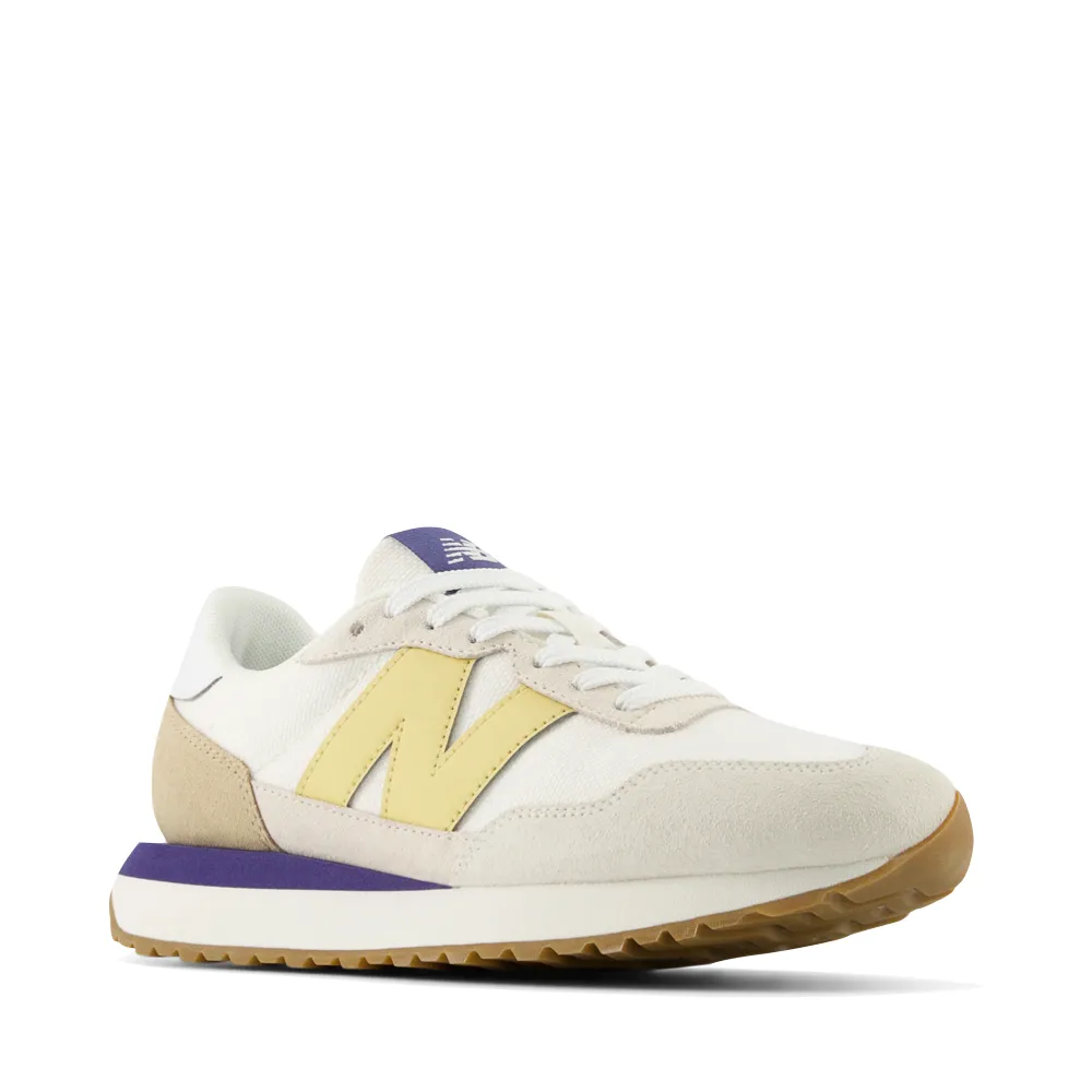 New Balance Women's 237 Sneaker in Sea Salt with Hay Orange And Purple New Balance